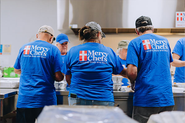 Volunteers preparing food; off of Mercy Chefs website