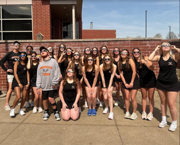 PHS Girls Tennis Team Photo looking up at the solar eclipse